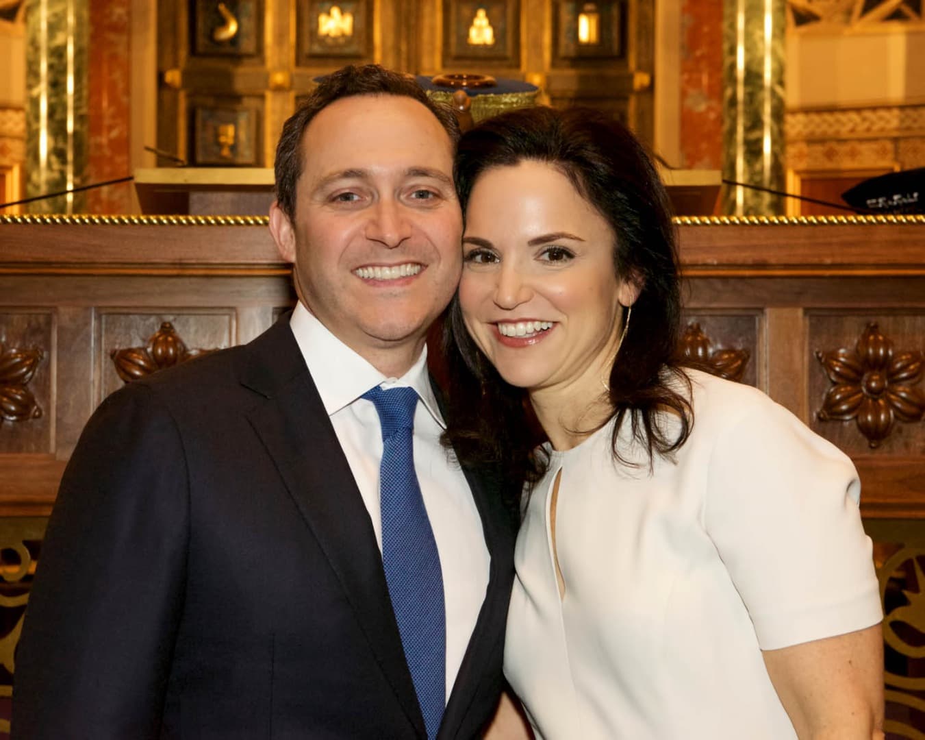 Couple smiling together in a synagogue
